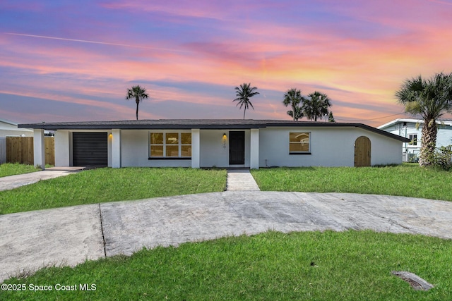 320 Alabama Ave, Merritt Island, FL 32953 - single story home featuring stucco siding, concrete driveway, and a garage
