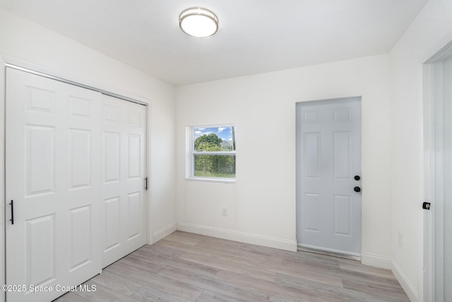 320 Alabama Ave, Merritt Island, FL 32953 - unfurnished bedroom featuring light wood finished floors and a closet