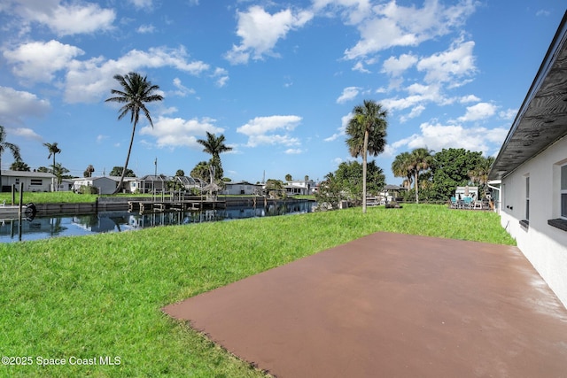 320 Alabama Ave, Merritt Island, FL 32953 - view of grassy yard with a water view, a patio, and a residential view