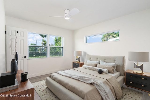 320 Alabama Ave, Merritt Island, FL 32953 - bedroom with light wood finished floors and ceiling fan