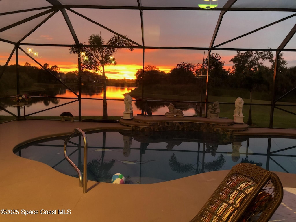 8252 Strom Park Dr, Melbourne, FL 32940 - outdoor pool with a patio, glass enclosure, and a water view