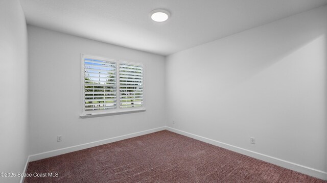 3110 Addison Dr, Melbourne, FL 32940 - carpeted empty room featuring baseboards