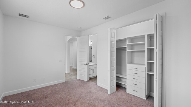 3110 Addison Dr, Melbourne, FL 32940 - unfurnished bedroom with carpet floors, a closet, and arched walkways
