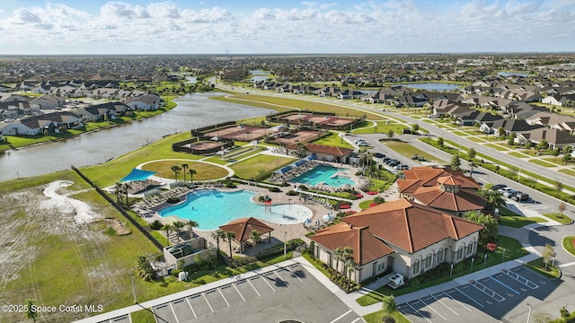 3110 Addison Dr, Melbourne, FL 32940 - aerial view of residential area featuring a pool and a nearby body of water
