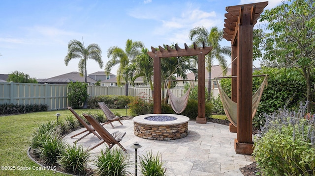 3110 Addison Dr, Melbourne, FL 32940 - fenced backyard with a fire pit and a patio