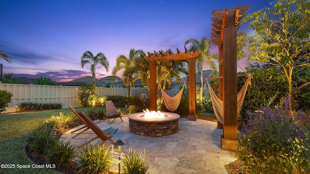 3110 Addison Dr, Melbourne, FL 32940 - patio terrace at dusk with a fire pit and a patio area