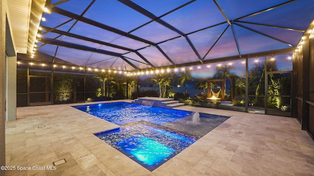3110 Addison Dr, Melbourne, FL 32940 - pool at dusk with a patio, a pool with connected hot tub, and a lanai