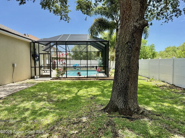 4569 Chastain Dr, Melbourne, FL 32940 - fenced backyard featuring a patio area
