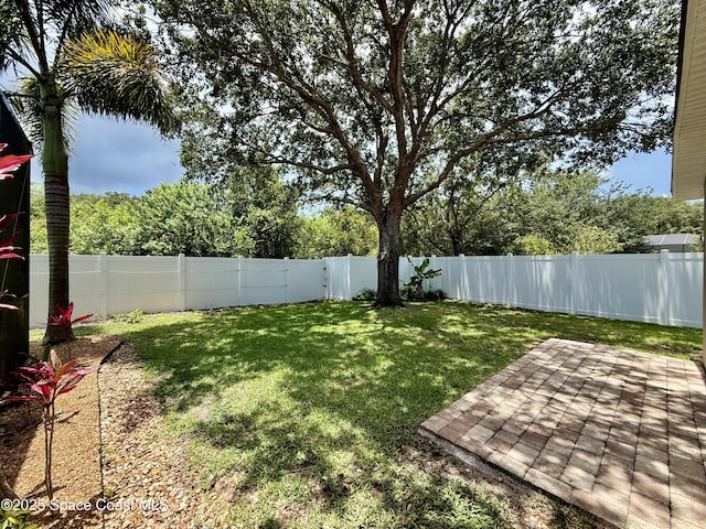 4569 Chastain Dr, Melbourne, FL 32940 - fenced backyard featuring a patio area
