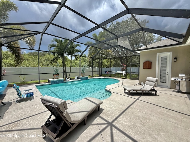 4569 Chastain Dr, Melbourne, FL 32940 - view of swimming pool featuring a patio area, a fenced backyard, glass enclosure, and area for grilling