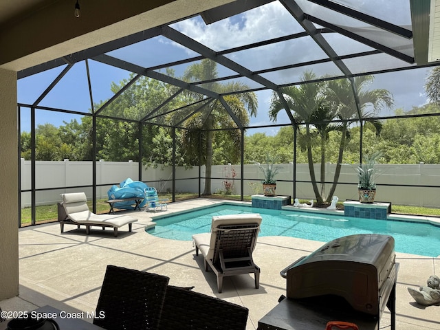 4569 Chastain Dr, Melbourne, FL 32940 - view of pool with a fenced backyard, a patio, grilling area, and glass enclosure