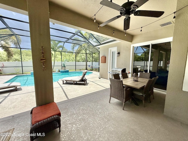 4569 Chastain Dr, Melbourne, FL 32940 - fenced backyard with a patio, ceiling fan, grilling area, and a lanai
