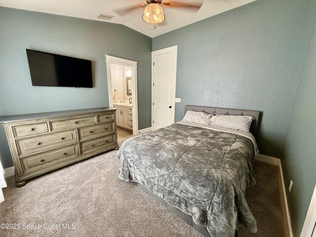 4569 Chastain Dr, Melbourne, FL 32940 - bedroom with light carpet, lofted ceiling, connected bathroom, and a ceiling fan