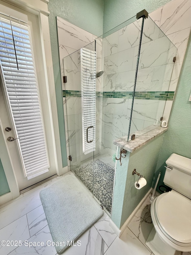 4569 Chastain Dr, Melbourne, FL 32940 - full bath featuring marble look tile flooring, a textured wall, and a marble finish shower