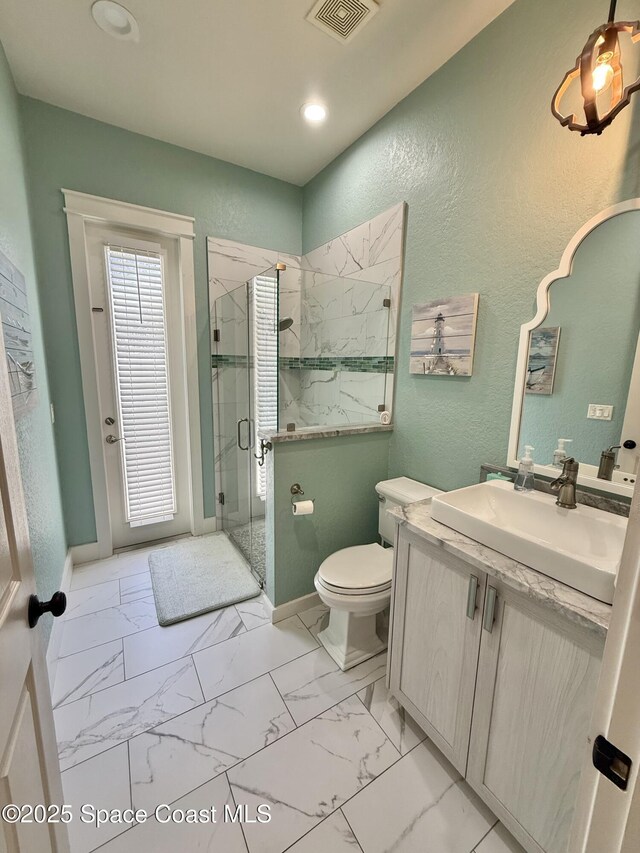 4569 Chastain Dr, Melbourne, FL 32940 - full bath with a marble finish shower, vanity, marble finish floors, a textured wall, and recessed lighting