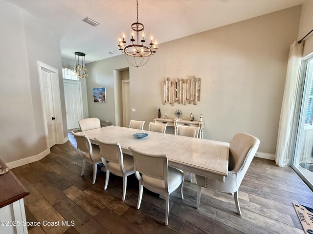 4569 Chastain Dr, Melbourne, FL 32940 - dining area with a chandelier and dark wood-type flooring