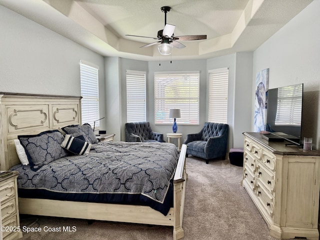 4569 Chastain Dr, Melbourne, FL 32940 - carpeted bedroom with a raised ceiling and ceiling fan