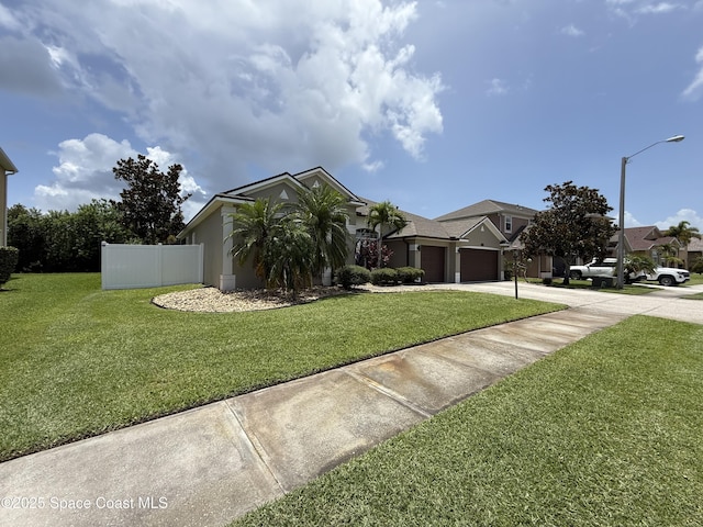 4569 Chastain Dr, Melbourne, FL 32940 - view of front facade featuring concrete driveway and an attached garage