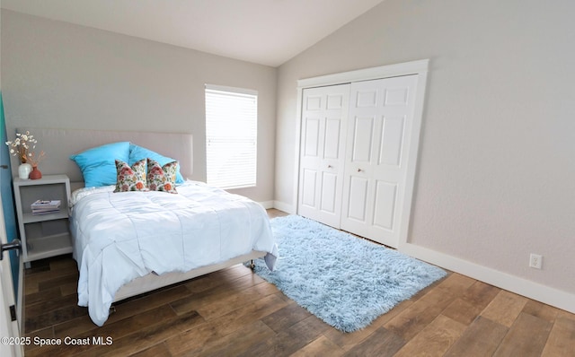 4569 Chastain Dr, Melbourne, FL 32940 - bedroom featuring lofted ceiling, wood finished floors, and a closet