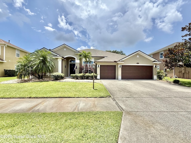4569 Chastain Dr, Melbourne, FL 32940 - single story home featuring stucco siding, an attached garage, concrete driveway, and a front yard