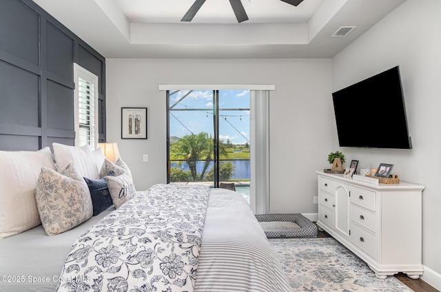 3243 Casare Dr, Melbourne, FL 32940 - bedroom featuring access to outside, ceiling fan, and a raised ceiling