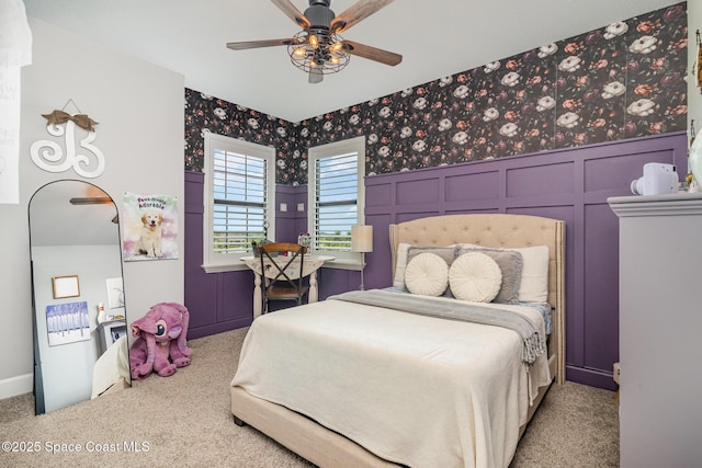3243 Casare Dr, Melbourne, FL 32940 - bedroom featuring carpet, a decorative wall, ceiling fan, and wainscoting