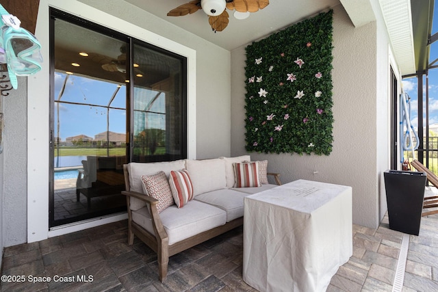 3243 Casare Dr, Melbourne, FL 32940 - view of patio / terrace with a ceiling fan and a water view