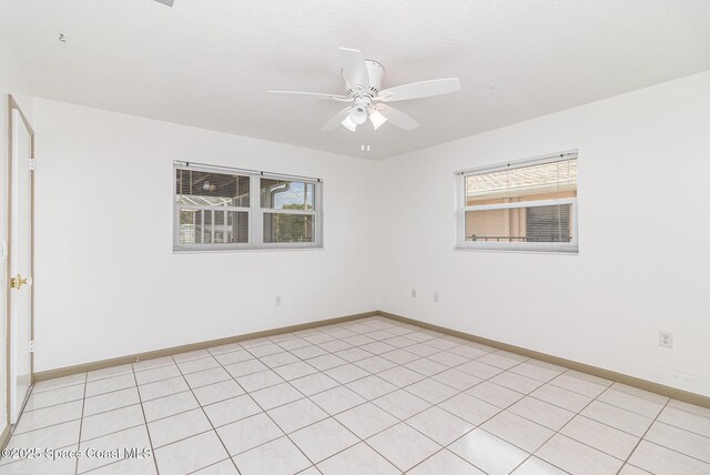 55 Yacht Haven Dr, Cocoa Beach, FL 32931 - unfurnished room featuring a ceiling fan and baseboards