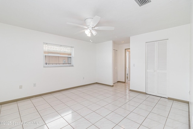 55 Yacht Haven Dr, Cocoa Beach, FL 32931 - unfurnished bedroom with baseboards and ceiling fan