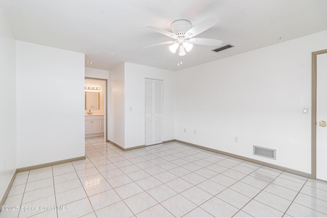 55 Yacht Haven Dr, Cocoa Beach, FL 32931 - unfurnished room with a ceiling fan and light tile patterned floors