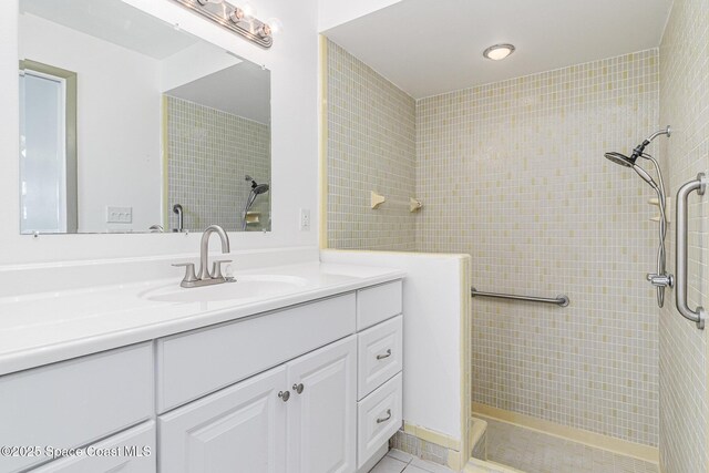 55 Yacht Haven Dr, Cocoa Beach, FL 32931 - full bathroom with tiled shower, vanity, and tile patterned floors