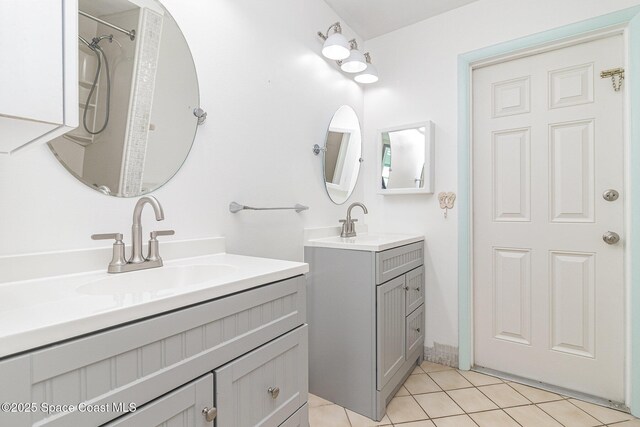 55 Yacht Haven Dr, Cocoa Beach, FL 32931 - bathroom with two vanities and tile patterned flooring