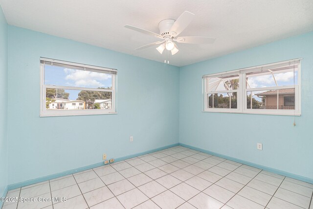 55 Yacht Haven Dr, Cocoa Beach, FL 32931 - spare room with healthy amount of natural light and a ceiling fan