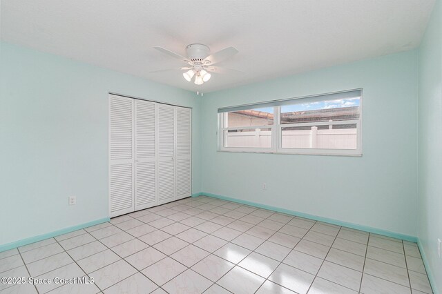 55 Yacht Haven Dr, Cocoa Beach, FL 32931 - unfurnished bedroom with a closet and ceiling fan