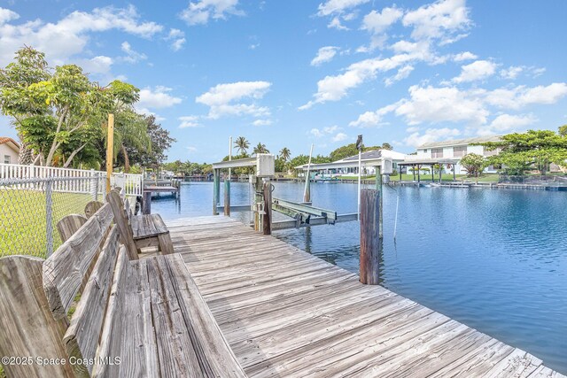 55 Yacht Haven Dr, Cocoa Beach, FL 32931 - dock area with a water view and boat lift