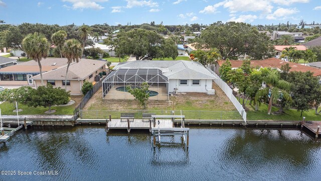 55 Yacht Haven Dr, Cocoa Beach, FL 32931 - dock with a water view, an outdoor pool, and a residential view