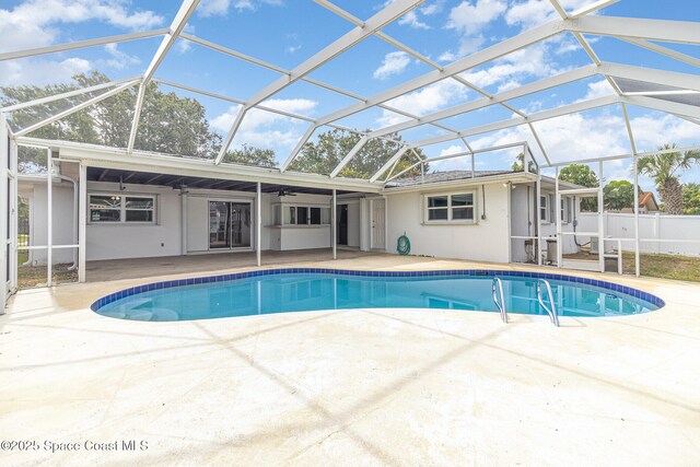 55 Yacht Haven Dr, Cocoa Beach, FL 32931 - view of pool featuring a patio area, ceiling fan, and glass enclosure