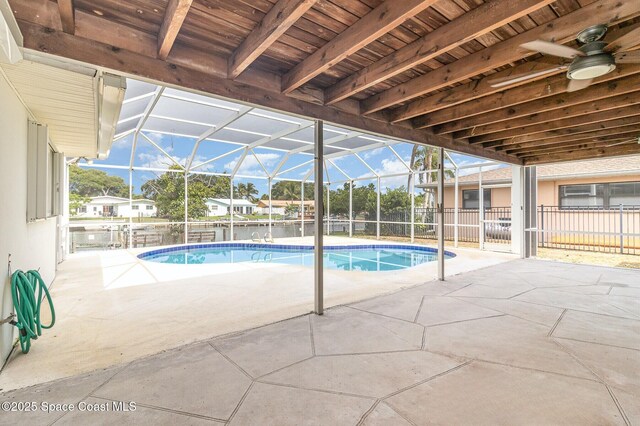 55 Yacht Haven Dr, Cocoa Beach, FL 32931 - view of pool featuring a patio area, a ceiling fan, and glass enclosure