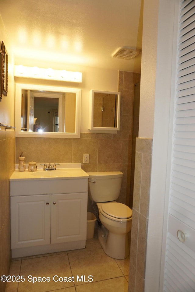 500 Palm Springs Blvd Unit 411, Indian Harbour Beach, FL 32937 - full bath with tile walls, tile patterned flooring, vanity, and a shower