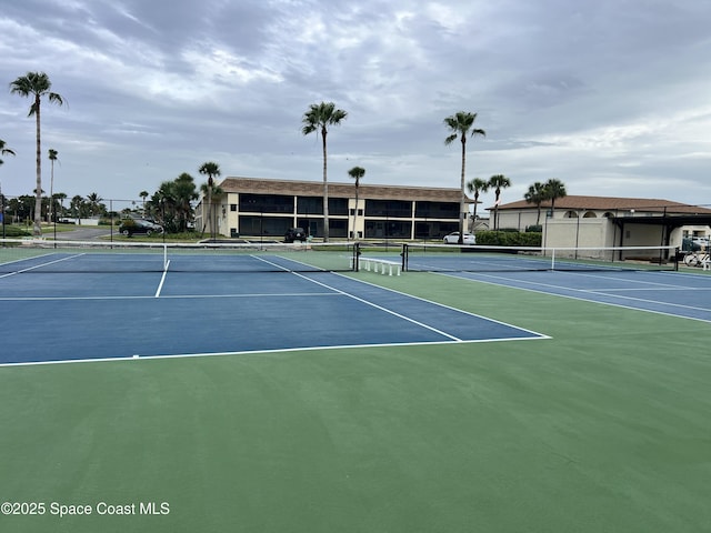 500 Palm Springs Blvd Unit 411, Indian Harbour Beach, FL 32937 - view of tennis court featuring community basketball court