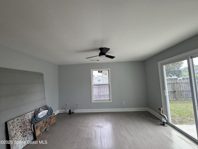 669 Vocelle Ave, Sebastian, FL 32958 - unfurnished room featuring wood finished floors, healthy amount of natural light, and ceiling fan