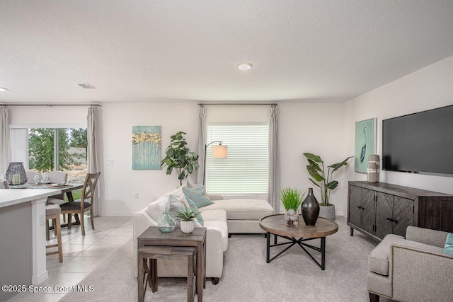 301 Latham St SE, Palm Bay, FL 32909 - living area with a textured ceiling, light tile patterned flooring, and recessed lighting