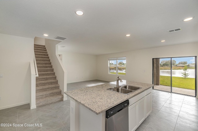 1811 Saxton Rd, Cocoa, FL 32926 - kitchen with stainless steel dishwasher, recessed lighting, a water view, open floor plan, and white cabinetry