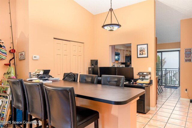1277 S Orlando Ave Unit 4B, Cocoa Beach, FL 32931 - home office with light tile patterned floors and a high ceiling