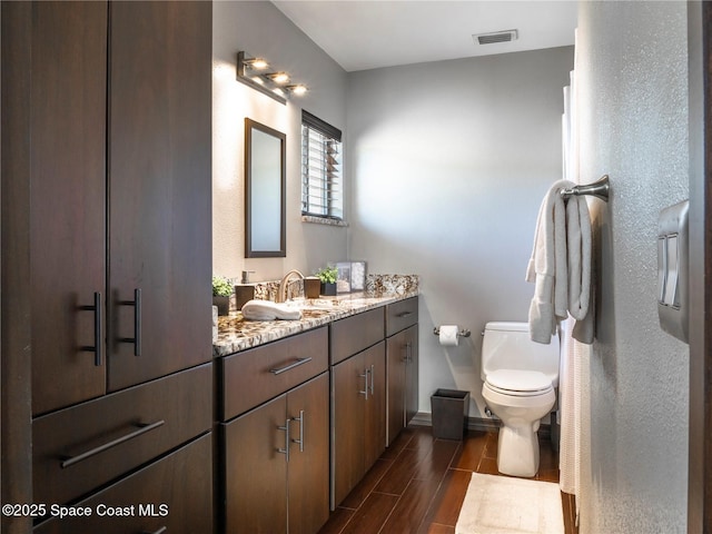 1277 S Orlando Ave Unit 4B, Cocoa Beach, FL 32931 - bathroom with double vanity and wood tiled floors