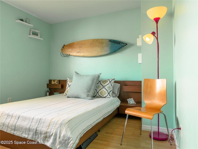 1277 S Orlando Ave Unit 4B, Cocoa Beach, FL 32931 - bedroom featuring wood finished floors