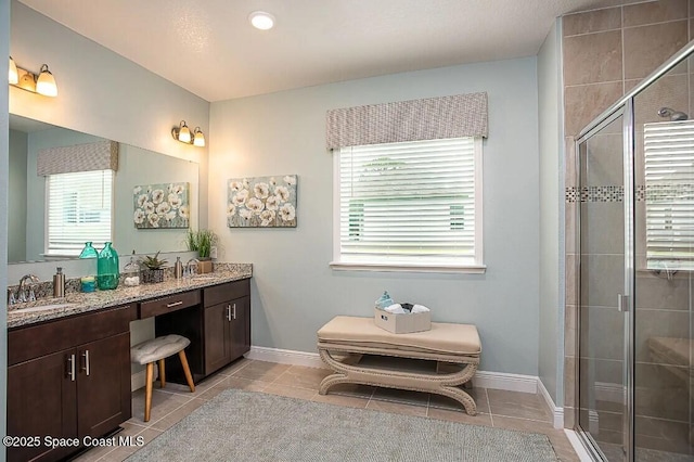 2411 Pinwherry St, Palm Bay, FL 32907 - full bathroom with tile patterned floors, a shower stall, and double vanity