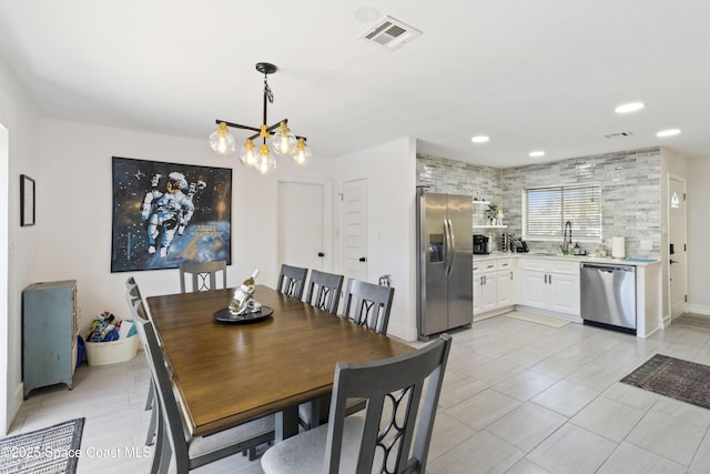 208 Atlantic Blvd, Indian Harbour Beach, FL 32937 - dining space with a chandelier, recessed lighting, and light tile patterned floors