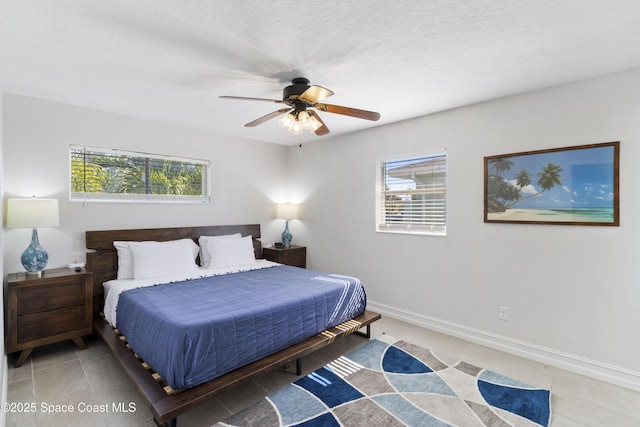 208 Atlantic Blvd, Indian Harbour Beach, FL 32937 - bedroom featuring multiple windows, ceiling fan, and tile patterned floors