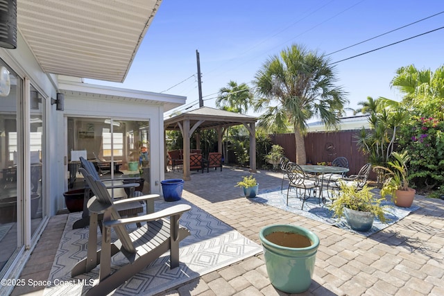 208 Atlantic Blvd, Indian Harbour Beach, FL 32937 - fenced backyard with a gazebo, a patio area, and outdoor dining space